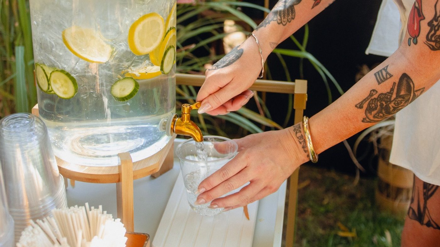 Water and lemonade dispensers at an Arizona outdoor wedding hosted by All About It Mobile Bar.
